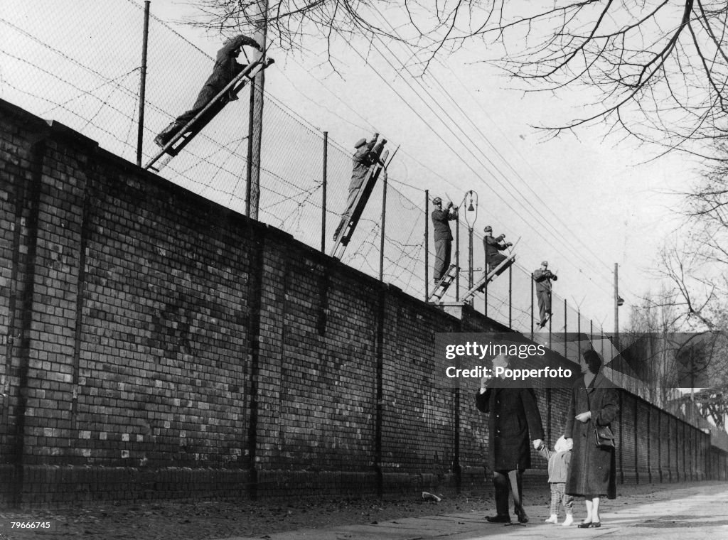 Berlin, Germany, 19th November, 1961, East Berlin border guards adding barbed wire to the newly built Berlin Wall, The wall was set up the Soviet army to prevent refugees escaping from the Soviet sector in the East to West Berlin