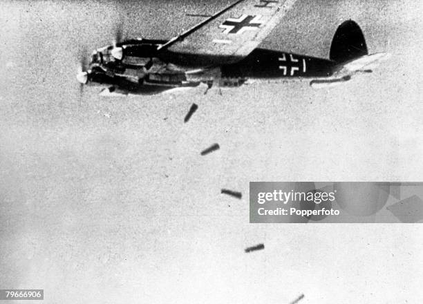 September 1940, Sticks of bombs dropping from a German Luftwaffe Heinkel He 111 medium bomber during World War II.