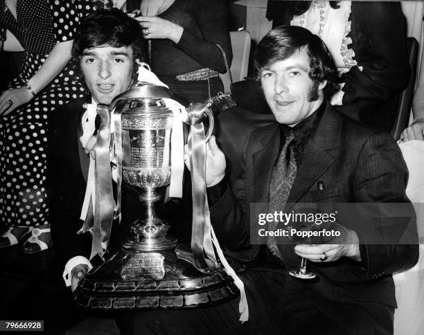 Football, Scotland, 9th May Celtic players Lou Macari and John Dean pose with the Scottish FA Cup trophy after defeating Hibernian 6-1 in the Final