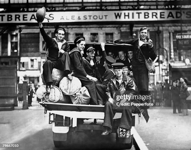 5th June 1940, Sailors who were the last to leave Dunkirk on completion of the Allied evacuation leaving a London railway station on the back of a...