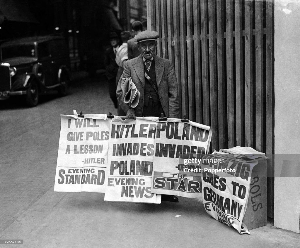 World War Two, Britain, 1st September 1939, A Newspaper vendor in a London street displays his headlines announcing the German invasion of Poland led by Nazi dictator Adolf Hitler