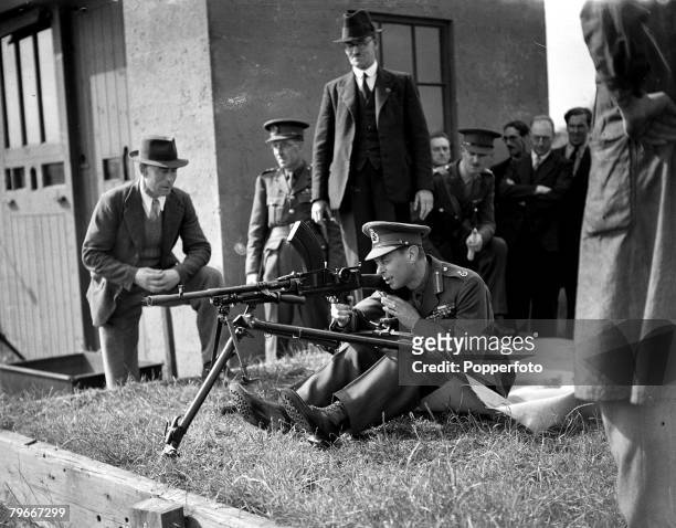 World War Two, 2nd, June 1940, King George VI is pictured firing a Bren light machine gun during a visit to a British Army military firing range...