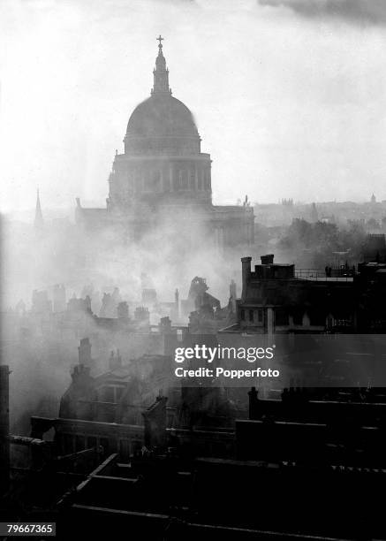 World War II, 12th March A general view of the City of London, with St Paul's Cathederal swathed in smoke, after a bombing raid by the German...