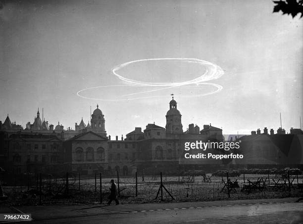 October 8th 1940, Smoke circles over Horse Guards Parade and the skyline of London as a dog fight between British Royal Air Force and German...
