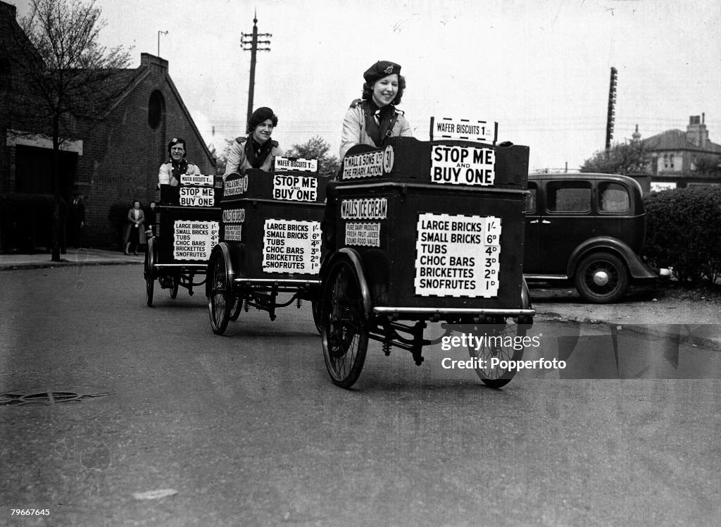 World War II, Three ice-cream girls set off on their rounds in London, they have taken over from men who have been called up to the services, 2nd May 1940