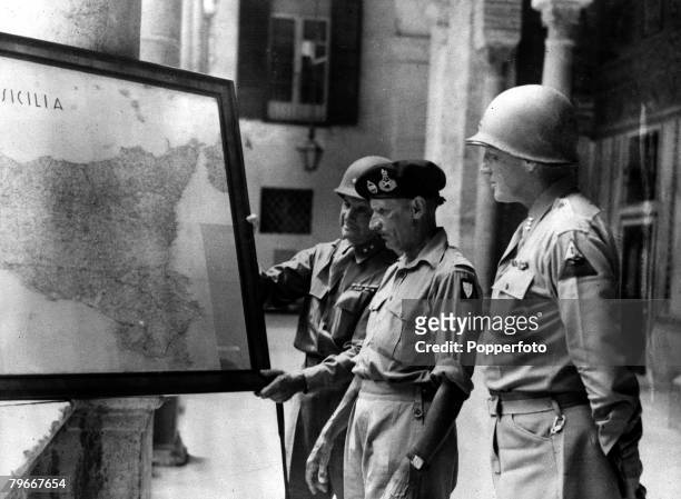 World War II, Major-General Geoffrey Keyes, General Sir Bernard Montgomery and Lieutenant-General George S, Patton studying a map of Sicily at the...