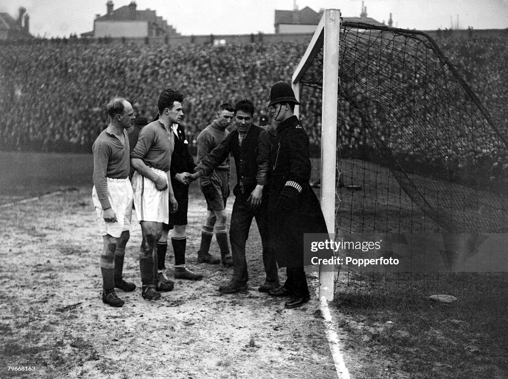 Football, London, England, 25th January 1931, FA Cup, A fan in the Everton goalmouth with goalkeeper Coggins and dismayed police and players attempting to persuade him to leave during the FA Cup match at Selhurst Park