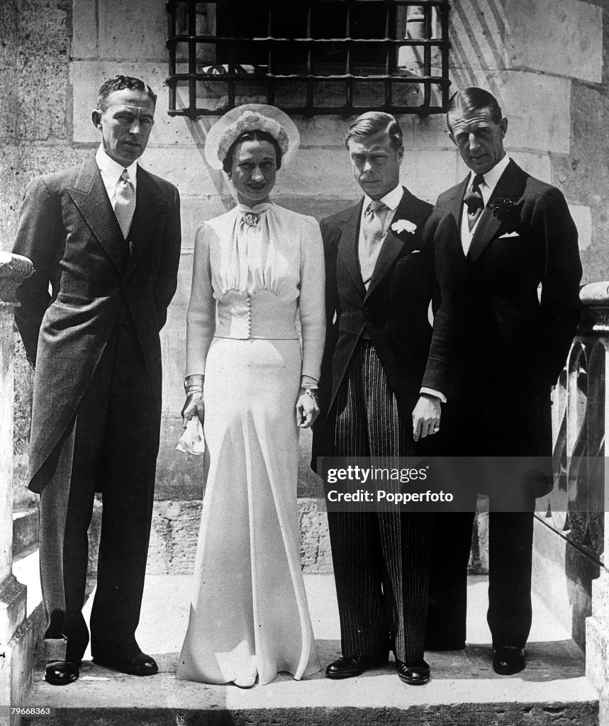 France, 3rd June, 1937, The Duke of Windsor, formerly King Edward VIII of England, and his wife Mrs, Wallis Simpson stand with the best man Major E,D, Metcalfe after the wedding ceremony at Chateau De Cande in France