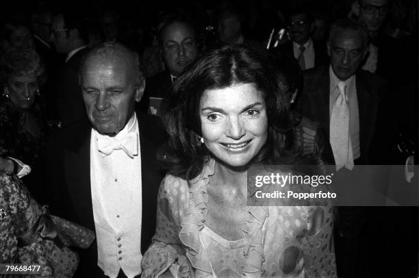 Year old Jaqueline Onassis the former Jackie Kennedy pictured smiling brightly as she arrives at New York's Metropolitan Opera House, 4th June 1973