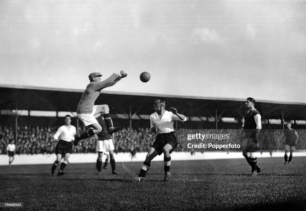 London, England, 21st September, 1929, West Ham goalkeeper Ted Hufton punches clear a Derby attack during their match at Upton Park