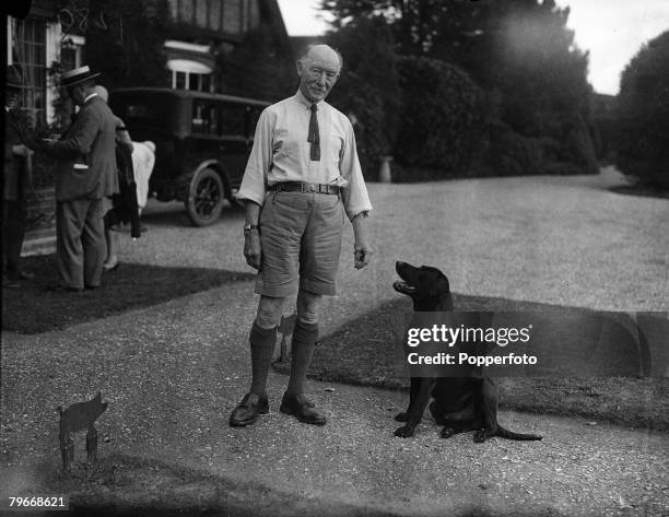 London, England Founder of the Scout movement Sir Robert Baden Powell with his pet dog outside his London home