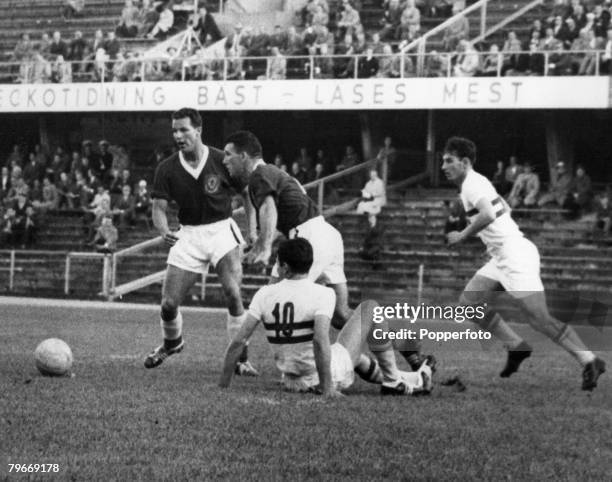 World Cup Finals, Stockholm, Sweden, 17th June Hungary 1 v Wales 2, Wales' Mel Charles and Stuart Williams race to clear the ball from Hungarians...