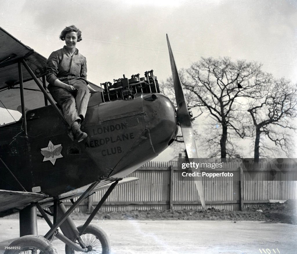 Aviation, London, 30th March, 1930, English pilot Miss Amy Johnson pictured resting from working on the engine of her De Havilland "Moth" aeroplane at Stag Lane airport in Hendon prior to her attempt to break the England-Australia flight record, She is th