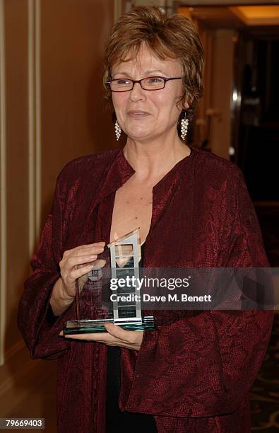 Julie Walters poses in the awards room with the Dilys Powell Award during the Awards Of The London Film Critics Circle, at the Grosvenor House Hotel...