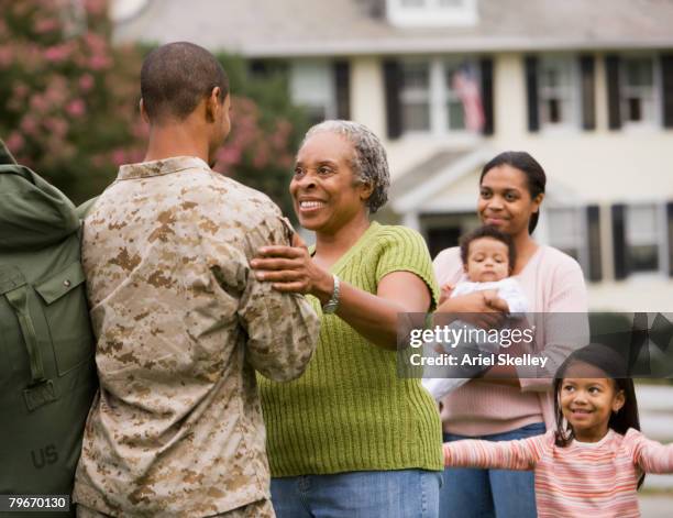 african american male soldier greeting family - 2007 24 stock pictures, royalty-free photos & images