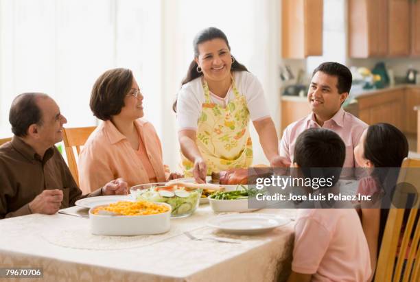 hispanic family at dinner table - puerto rican people stock pictures, royalty-free photos & images