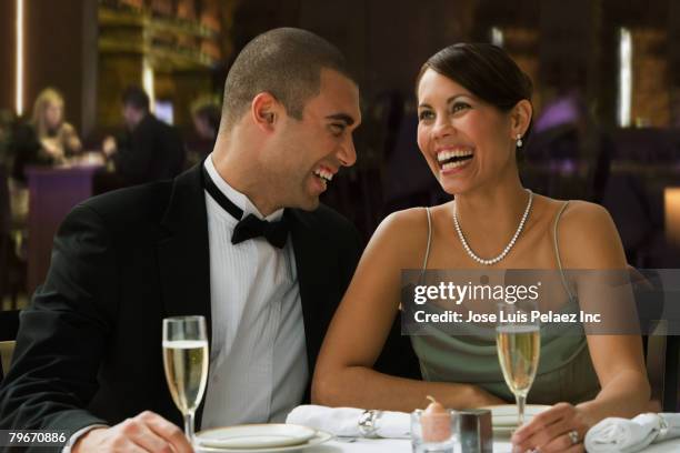 hispanic couple at restaurant - formal dining stock pictures, royalty-free photos & images