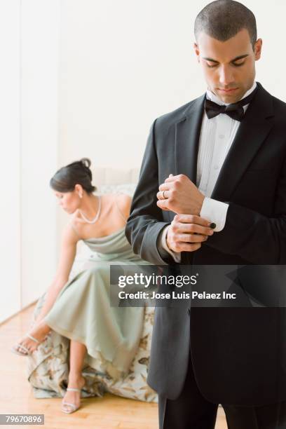 hispanic couple in evening wear - cufflink stock pictures, royalty-free photos & images