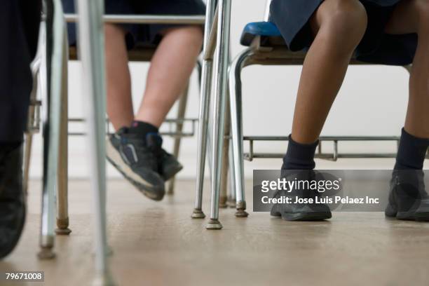 multi-ethnic children's legs in classroom - tween heels stock pictures, royalty-free photos & images