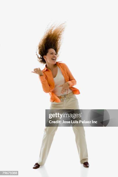 hispanic woman dancing - rock object stockfoto's en -beelden