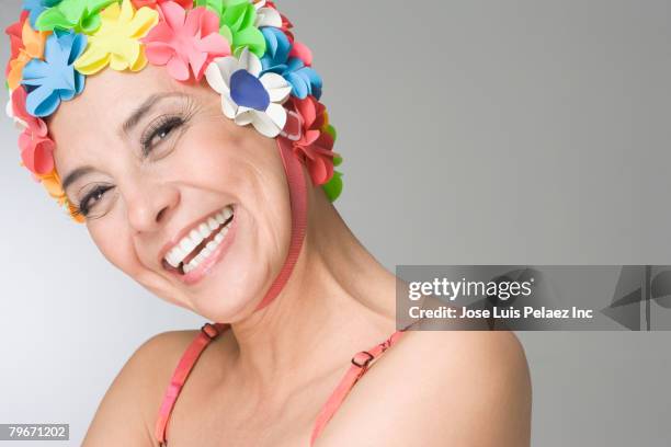 hispanic woman wearing swimming cap - adult glamour stock pictures, royalty-free photos & images