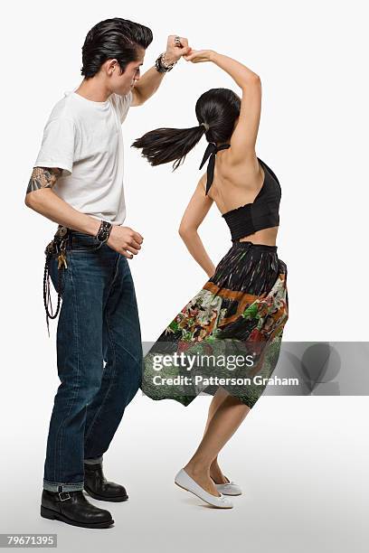 asian couple dancing - women dancing on music cutout photos et images de collection