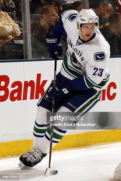 Alexander Edler of the Vancouver Canucks handles the puck against the Florida Panthers at the Bank Atlantic Center on February 1, 2008 in Sunrise,...
