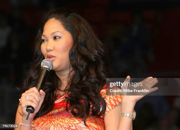 Kimora Lee Simmons refers to notes written on her hand for her speech at the Market America Leadership School at the American Airlines Arena on...