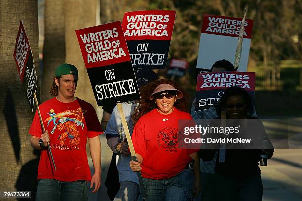 Writers Guild of America members and supporters picket in front of NBC studios as hope grows that a draft copy of a proposed deal with Hollywood...