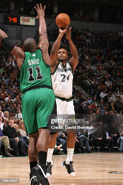 Antoine Walker of the Minnesota Timberwolves takes a shot against Glen Davis of the Boston Celtics at the Target Center February 8, 2008 in...