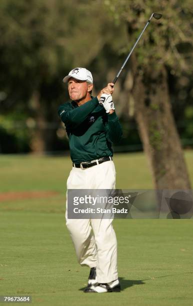 Gary Player hits onto the 18th green during the first round the Allianz Championship held on February 8, 2008 at The Old Course at Broken Sound Club...