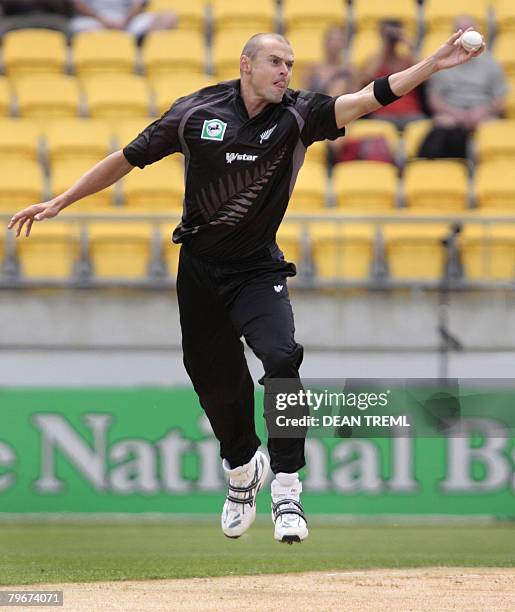 Chris Martin of New Zealand fields a shot from Phil Mustard of England during the first one day international match between New Zealand and England...