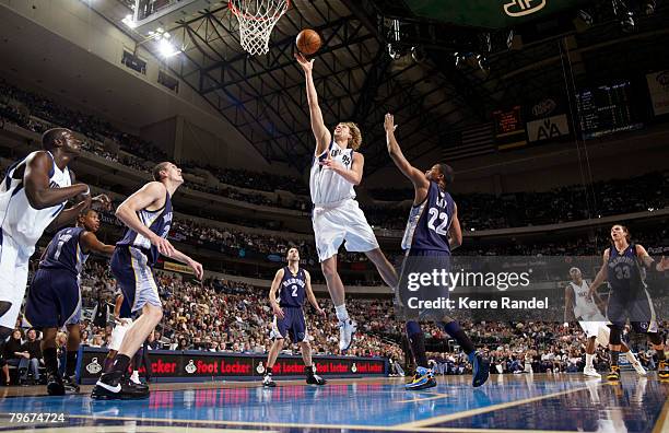 Dirk Nowitzki of the Memphis Grizzlies goes for the layup against Rudy Gay of the Dallas Mavericks at the American Airlines Center February 8, 2008...