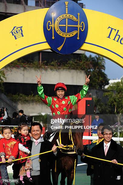 Almond Lee ridding "Full of Joy" celebrates after winning the Chinese New Year Race at the Sha Tin race course in Hong Kong on February 9, 2008. The...