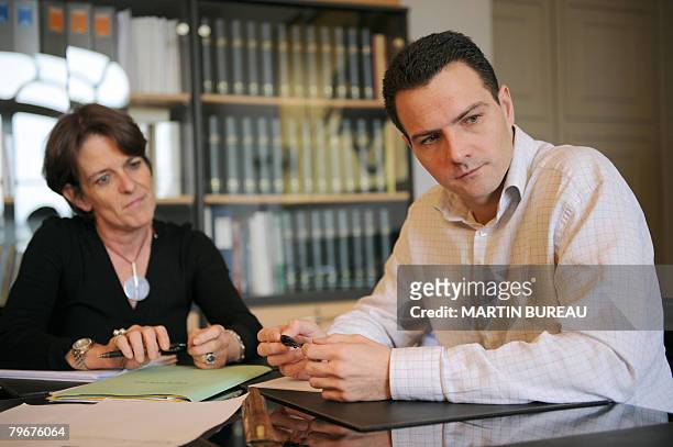French trader Jerome Kerviel poses with his lawyer Elisabeth Meyer, February 5, 2008 at the lawyer?s office in Paris. Kerviel was questioned today by...