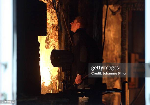 Member of the Austrian firebrigade scrutinizes the burnt walls of the Vinzenheim, home for the elderly, after a night time fire catastrophy on...