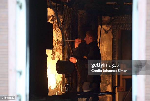 Member of the Austrian firebrigade scrutinizes the burnt walls of the Vinzenheim, home for the elderly, after a night time fire catastrophy on...