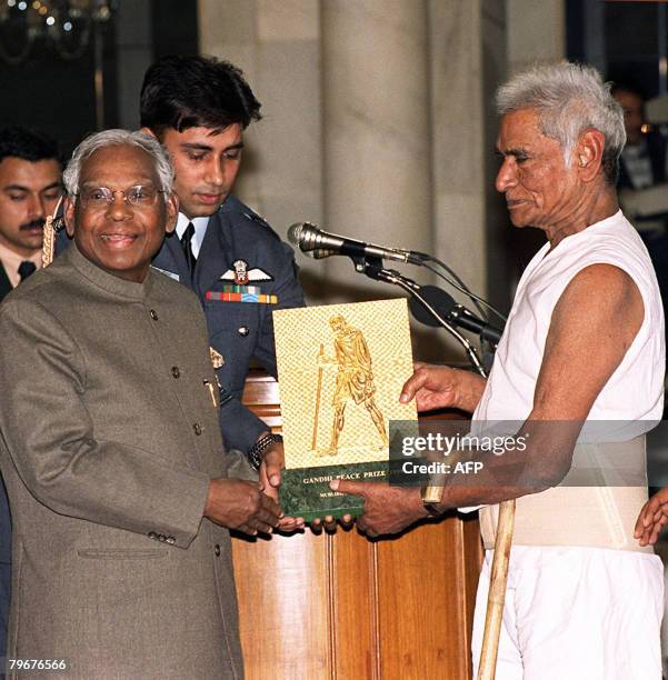 In this file photo taken January 14, 2000 Indian President K.R. Narayanan awards the annual Gandhi Peace Prize of 1999 to Murlidhar Devidas Amte at...