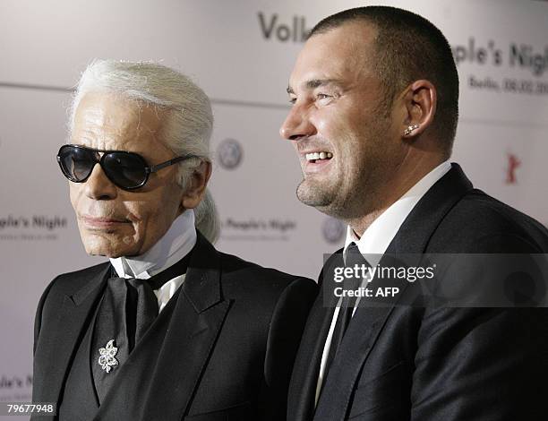 German fashion designers Karl Lagerfeld and Michael Michalsky pose for photographers on the red carpet of the Volkswagen People's Night, an event in...