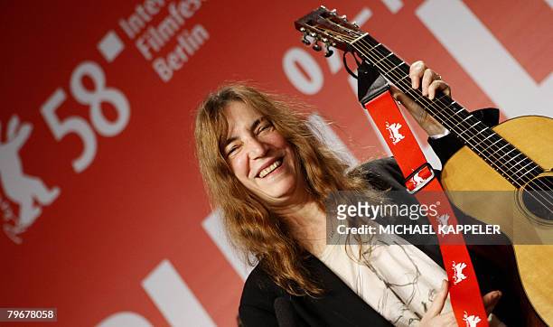 Singer Patti Smith smiles after performing during a press conference for the movie "Patti Smith: Dream of Life" presented in the Panorama catagory of...