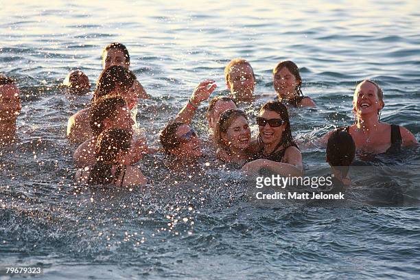 Kate Ledger with family and friends swim in the ocean outside of the Indiana Tea House at Heath Ledger's wake on February 9, 2008 in Perth,...