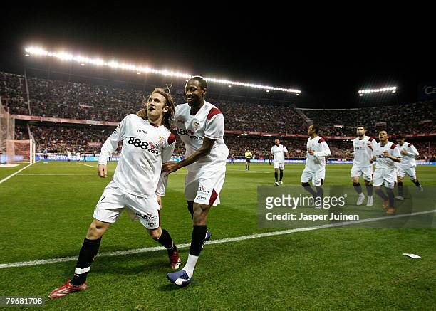 Diego Capel of Sevilla celebrates his opening goal with his teammate Seydou Keita during the La Liga match between Sevilla and Barcelona at the Ramon...