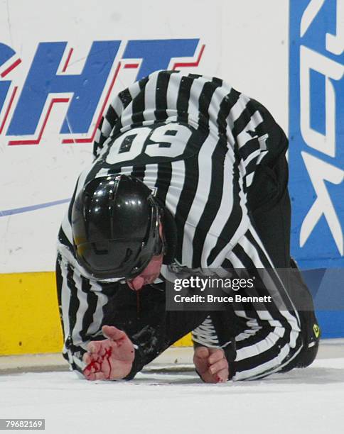 Linesman Pat Dapuzzo is injured by the skate of Steve Downie of the Philadelphia Flyers in the game against the New York Rangers on February 9, 2008...