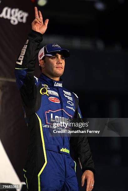 Jimmie Johnson, driver of the Lowe's Chevrolet, waves to the crowd prior to the Budweiser Shootout at Daytona International Speedway on February 9,...