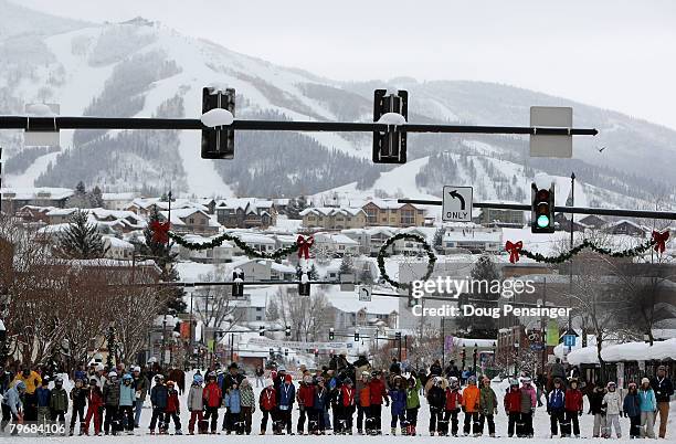 Participants line up for the start of the three legged ski race on Lincoln Avenue during the Street Events at the 95th Annual Steamboat Springs...