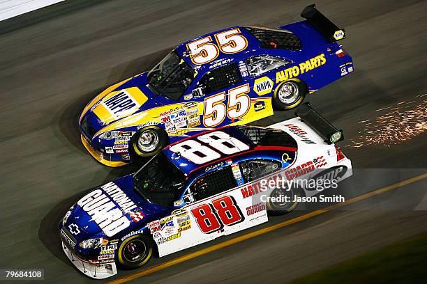 Dale Earnhardt Jr., driver of the Mountian Dew AMP/National Guard Chevrolet, races along side Michael Waltrip, driver of the NAPA Auto Parts Toyota,...