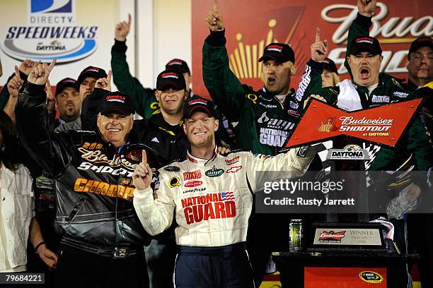 Dale Earnhardt Jr., driver of the Mountian Dew AMP/National Guard Chevrolet, celebrates in victory lane with team owner Rick Hendrick after winning...