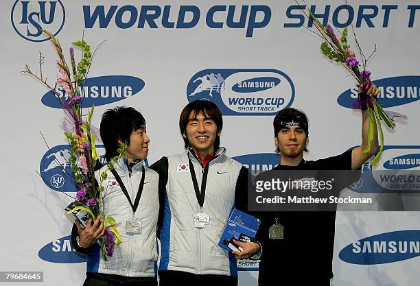 Ho-Suk Lee of South Korea, Seung-Hoon Lee of South Korea and Apolo Anton Ohno pose for photographers on the medals podium the 1500 meter final during...