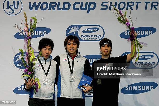 Ho-Suk Lee of South Korea, Seung-Hoon Lee of South Korea and Apolo Anton Ohno pose for photographers on the medals podium the 1500 meter final during...