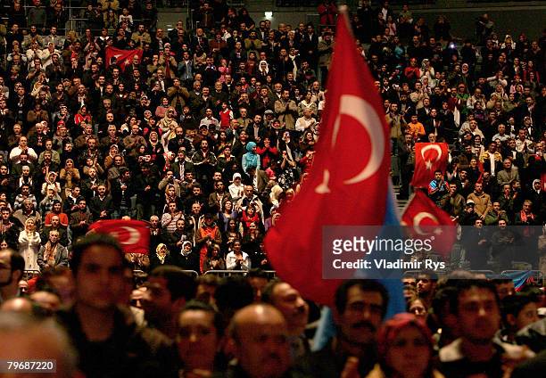 Turkish citizens are seen in a sold out KoelnArena priro to the speach of the Turkish Prime Minister Recep Tayyip Erdogan on February 10, 2008 in...